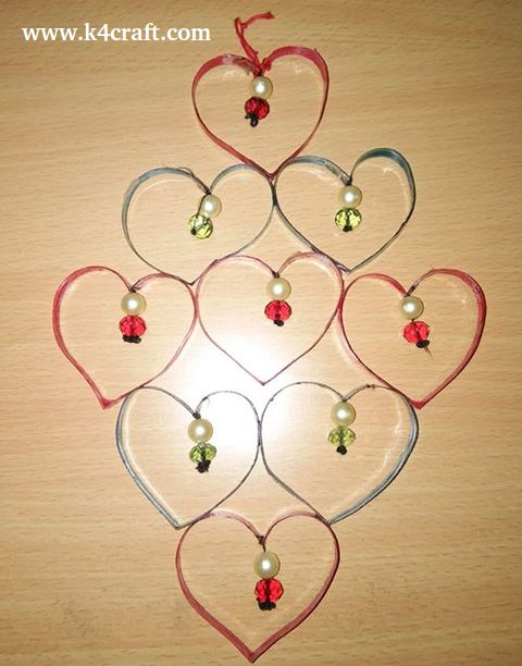 DIY cardboard and bead heart shape wall hanging